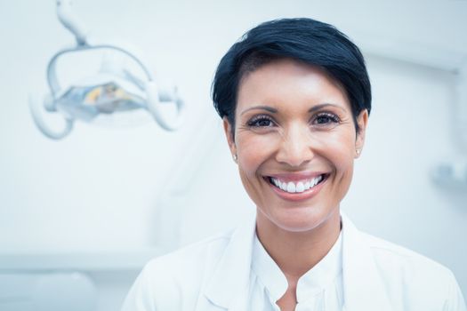 Close up portrait of happy confident female dentist