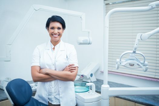 Portrait of confident female dentist with arms crossed