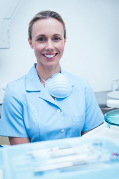 Close up portrait of smiling young female dentist