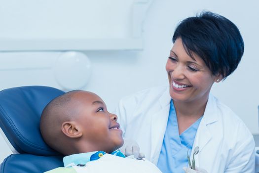 Side view of smiling boy waiting for a dental exam 