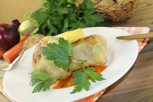 cabbage rolls with potatoes and parsley on a napkin