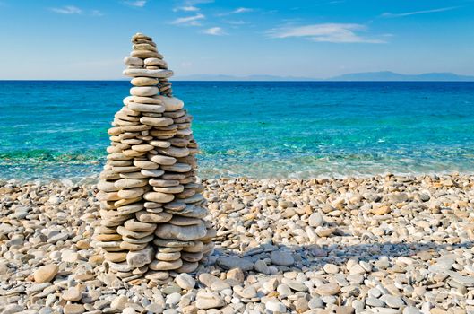 Pebble tower on the beach of the aegean island of Samos