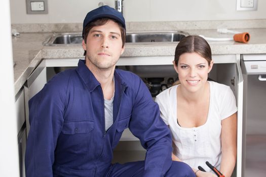 Pair of plumbers looking at camera