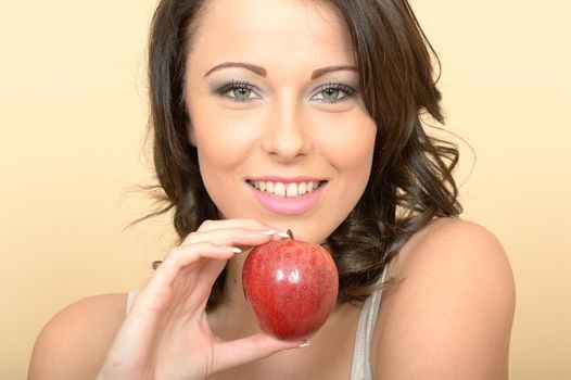 Attractive Beautiful Young Woman Holding a Tasty Ripe Juicy Sweet Red Apple