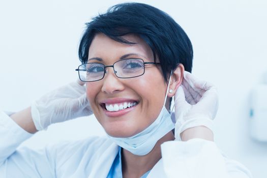 Close up portrait of smiling young female dentist