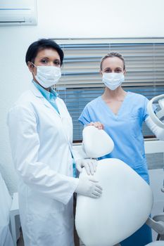 Portrait of two female dentists wearing surgical masks