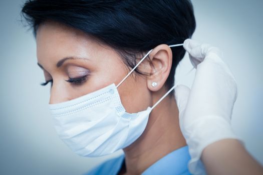 Close up of female dentist wearing surgical mask