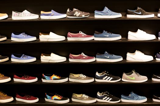 Selection of Wall Mounted Colourful Trainers in a Shop Display