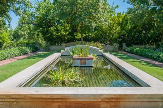 PAARL, SOUTH AFRICA - DECEMBER 11, 2014:  Formal garden with fish dam on a farm near Paarl