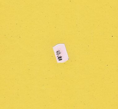 40.00 price tag label over yellow paperboard background