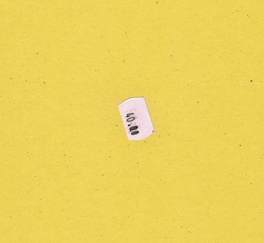 40.00 price tag label over yellow paperboard background