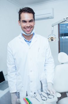 Portrait of smiling young male dentist