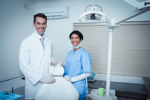 Portrait of smiling male and female dentists