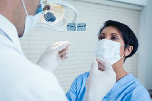 Concentrated two dentists looking at x-ray