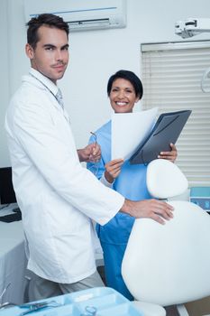 Portrait of smiling male and female dentists