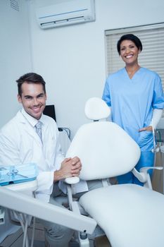 Portrait of smiling male and female dentists