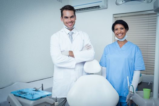 Portrait of smiling male and female dentists