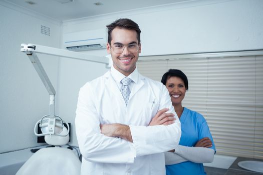 Portrait of smiling male and female dentists