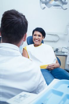 Portrait of smiling young woman waiting for a dental exam