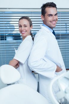 Portrait of smiling male and female dentists