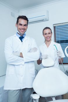 Portrait of smiling male and female dentists