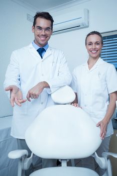 Portrait of smiling male and female dentists