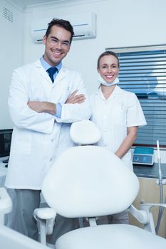 Portrait of smiling male and female dentists