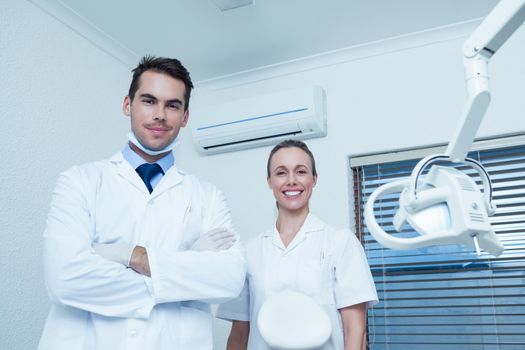 Portrait of smiling male and female dentists