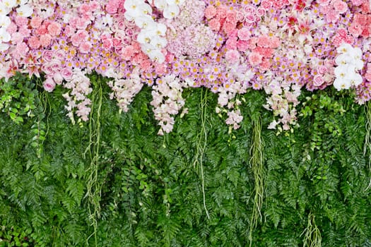 backdrop pink flowers and green leaf arrangement for wedding ceremony