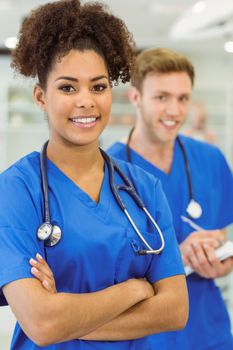 Young medical students smiling at the camera at the university