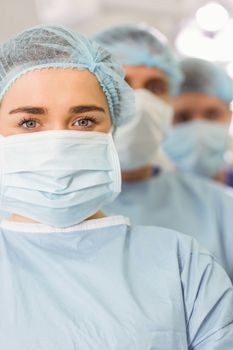 Team of surgeons looking at camera at the university