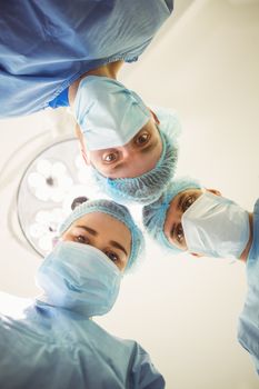 Young surgeons looking down at camera  at the university