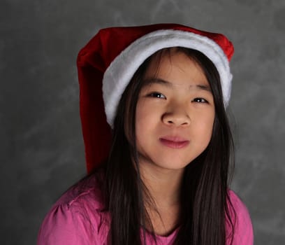 Cute girl smile with christmas  red hat