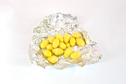 Lotus Seeds on foil isolate on white background