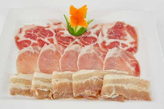 Assorted Fresh Cured Meats on white dish isolate