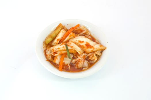 close-up kimuchi on white dish isolate on white background