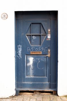 blue Wooden Doorway with Graffiti in Skagen Stavanger City Centre Norway