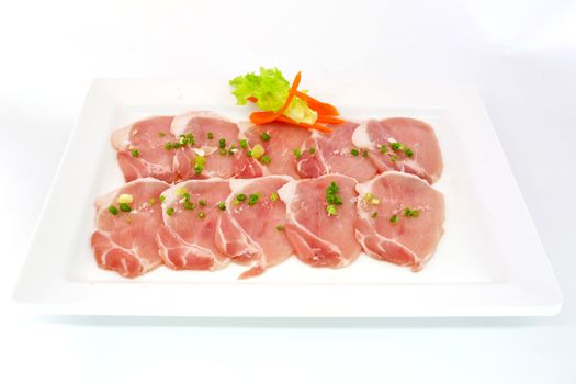 freshness slided pork on white dish for grill