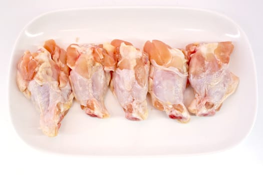 Fresh raw chicken wings isolate on white background ready to be grilled