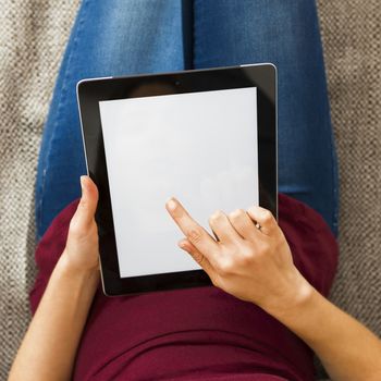 Cropped shot of female hands working with a tablet, tablet with copy space 