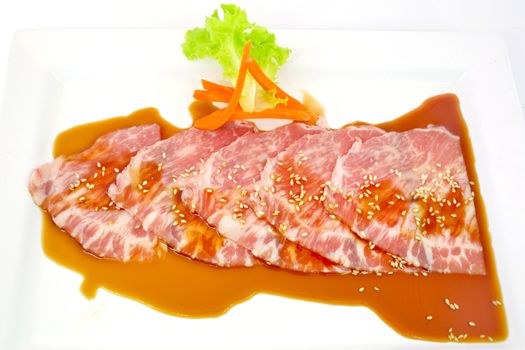 freshness slided pork on white dish for grill