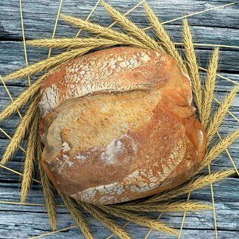 A bread campaign on a wooden and old table surrounded by wheat ears. We can almost smell, touch and eat this bread.