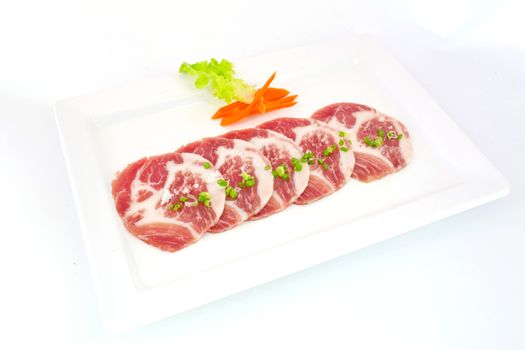 freshness slided pork on white dish for grill
