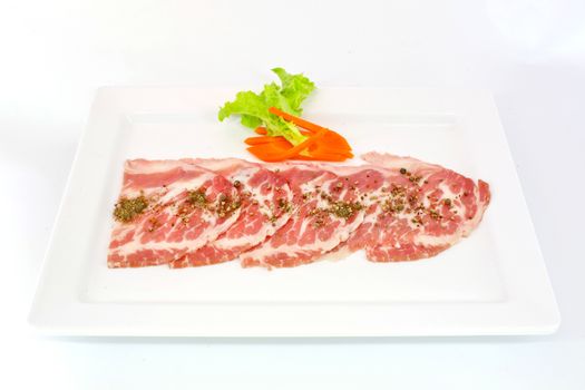 freshness slided pork on white dish for grill