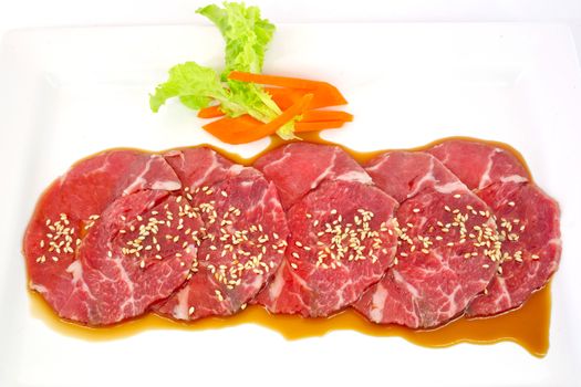 High grade sliced Hida wagyu beef isolated on white background