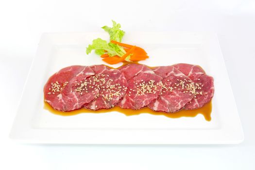 High grade sliced Hida wagyu beef isolated on white background