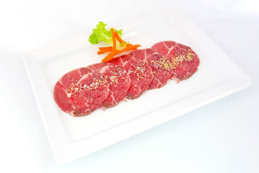 High grade sliced Hida wagyu beef isolated on white background