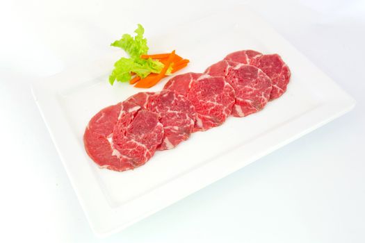 High grade sliced Hida wagyu beef isolated on white background