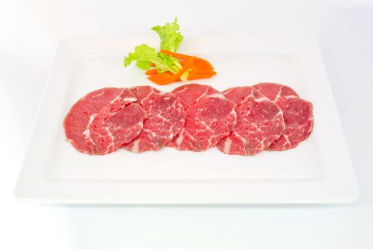 High grade sliced Hida wagyu beef isolated on white background