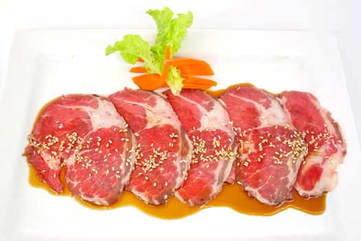 High grade sliced Hida wagyu beef isolated on white background